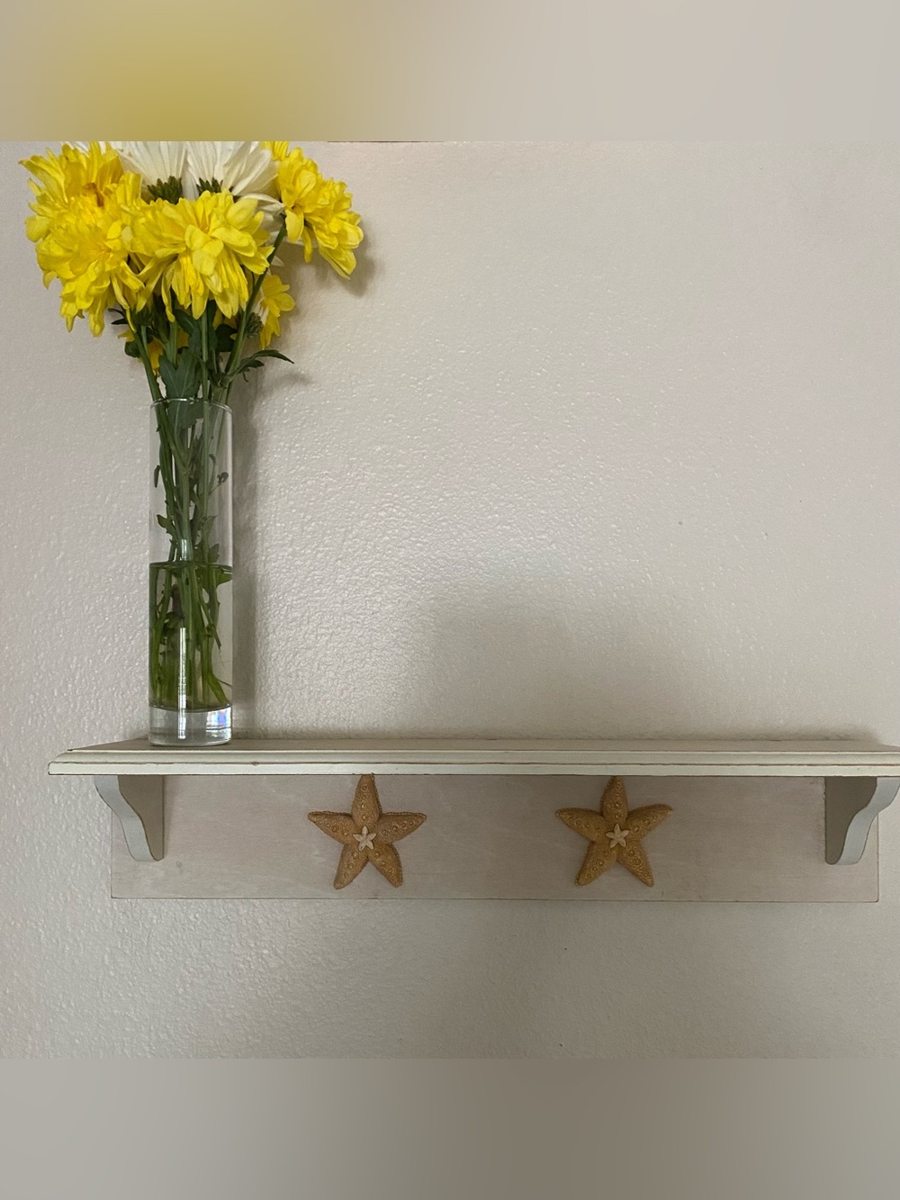 Vintage rustic white wood wall shelf featuring starfish coastal design